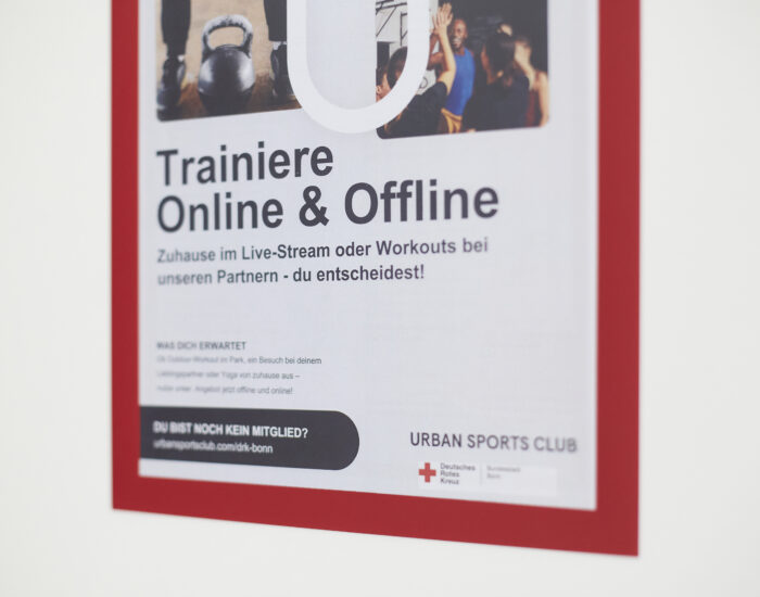 Ein Aushang, auf dem über den Urbansports Club informiert wird.